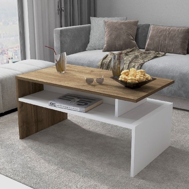 This coffee table, elegant and functional, is the perfect solution to furnish the living area and to keep magazines and small objects tidy. Mounting kit included, easy to clean and easy to assemble. Color: White, Oak | Product Dimensions: W90xD50xH43 cm | Material: Melamine Chipboard | Product Weight: 16 Kg | Supported Weight: 40 Kg | Packaging Weight: 17,5 Kg | Number of Boxes: 1 | Packaging Dimensions: 93,6x53,6x43 cm.
