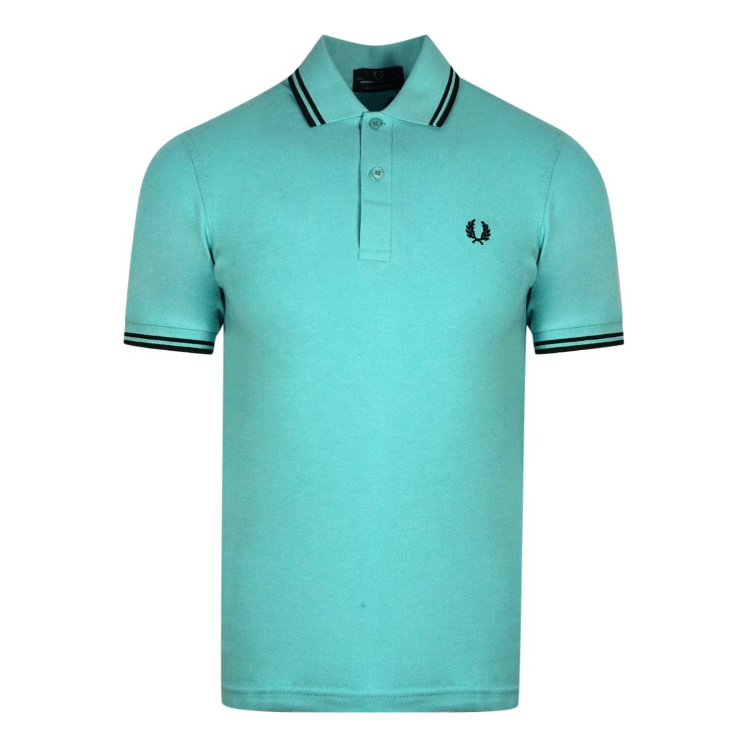 Fred Perry M12 H69 Blue Polo Shirt. Fred Perry Blue Polo Shirt. Pattern On Collar. Button Closure At The Neck. 100% Cotton. Style: M12 H69