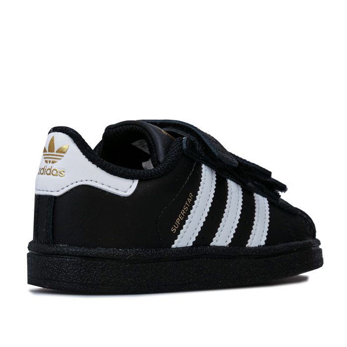 Infant adidas Originals Superstar CF Trainers in White Black.<BR><BR>- Hook and loop fastening.<BR>- Premium leather upper.<BR>- Classic rubber shell toe.<BR>- Padded collar and tongue.<BR>- Comfortable textile lining.<BR>- Contrast 3-Stripes to sides.<BR>- Gold print ‘Superstar’ to side.<BR>- Printed Trefoil logo to tongue.<BR>- Contrast heel patch with printed Trefoil logo.<BR>- Removable adi-Fit sockliner.<BR>- Herringbone-pattern rubber cupsole.<BR>- Leather and Synthetic upper  Synthetic and Textile lining  Synthetic sole.<BR>- Ref: BZ0419