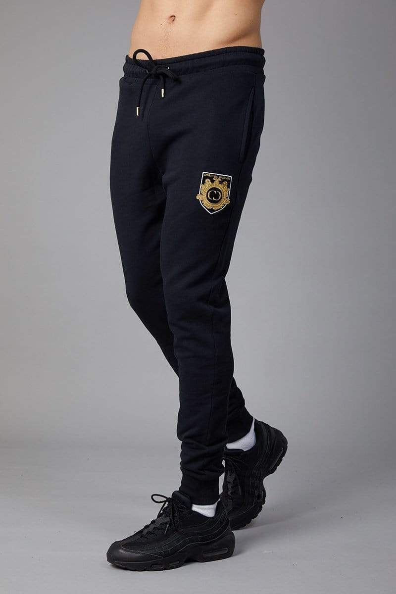 Black joggers with embroidered gold/white CD crest on left leg, with black drawstring waistband, Slim fit, 2 front pockets and 1 back pocket, Black drawstring