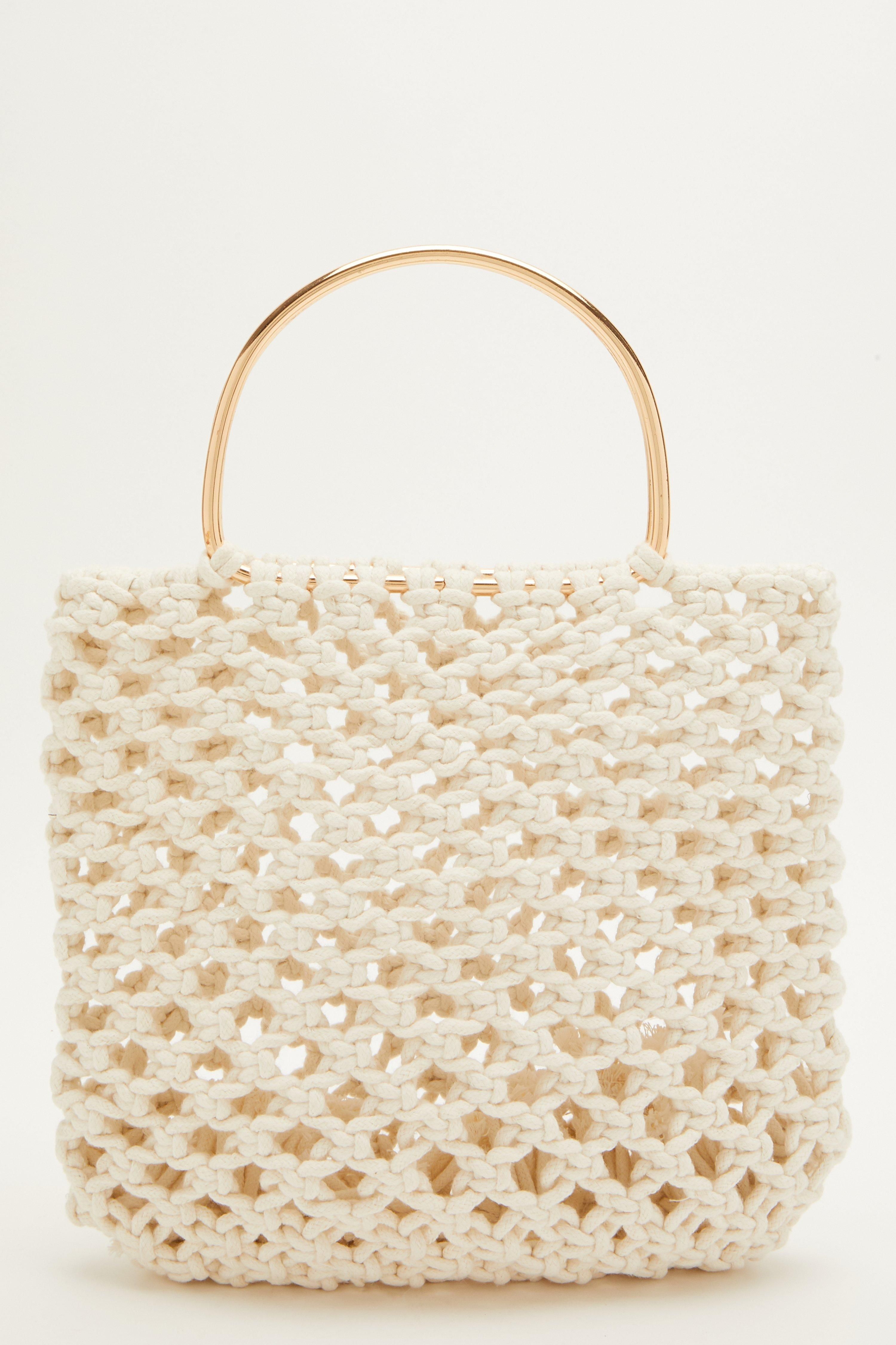 - Crochet finish  - Metal handle  - Handbag style  - Round handle
