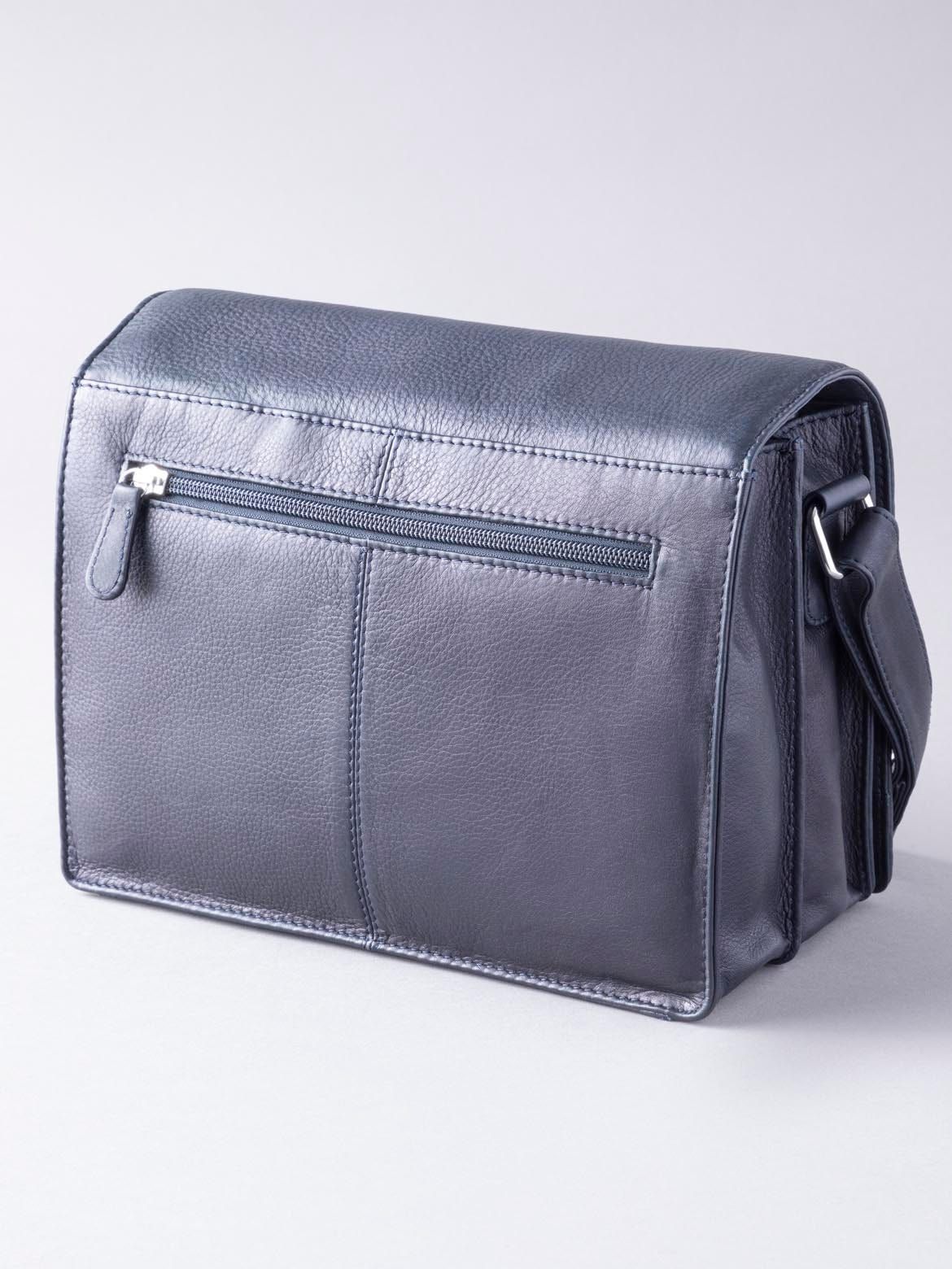 Elegant on the outside and hardworking on the inside, the Ennerdale Leather Organiser Bag in Navy is the perfect work week companion. Embrace this practical yet stylish bag, with pockets for everything from your phone to your cards, and large central compartments for near enough everything else, all neatly housed under the large flapover magnetic design. The long leather and fabric shoulder strap is ideal for slinging over the shoulder or carrying cross body. It's a bag made for business.
