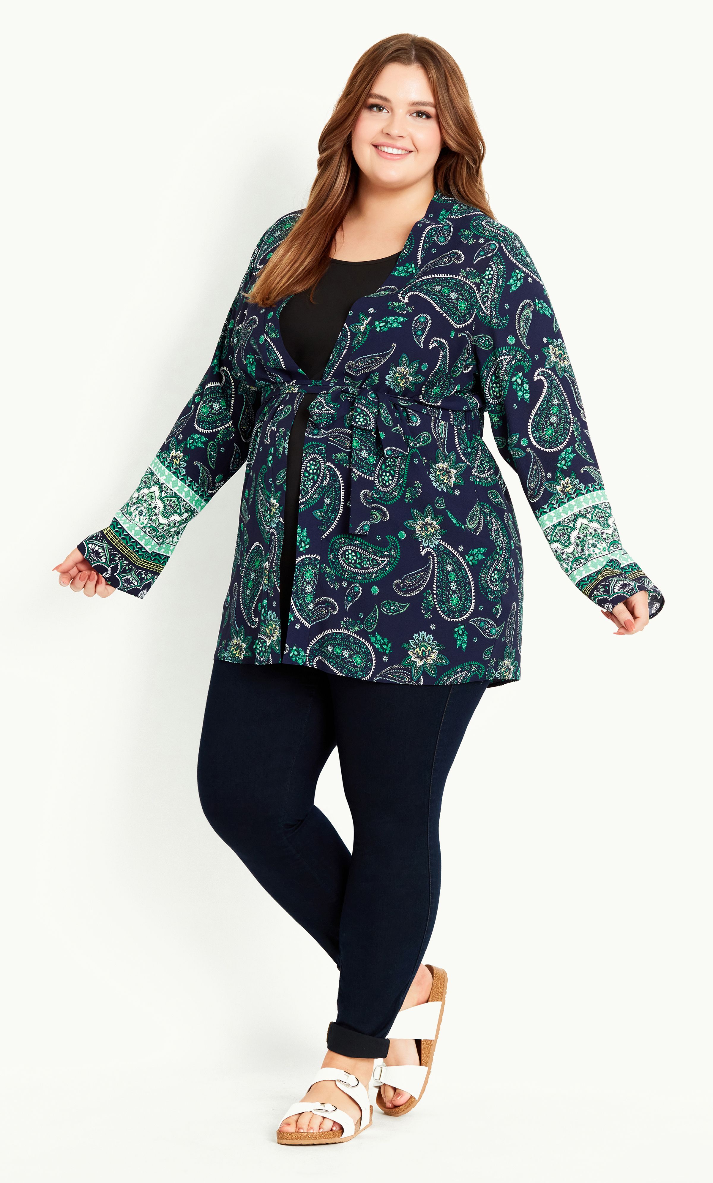 A whimsical layer to your casual outfit! The Paisley Print Kimono features a floaty, lightweight fabrication and eye-catching paisley print, perfect for bringing added style and a pop of print. Elevated by flared sleeves, it's a fun-loving choice for the summer! Key Features Include: - Long flared sleeves - Attached self-tie front - Elasticated back waist - Lightweight non-stretch fabrication - Relaxed fit - Unlined - Hip length Layer over a black tee and jeans, finishing with chunky sandals and a tote.