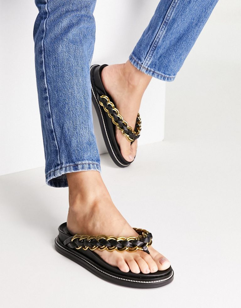 Sandals by ASOS DESIGN Free your feet Slip-on style V-shaped straps Chain detail Toe post Flat sole Sold By: Asos