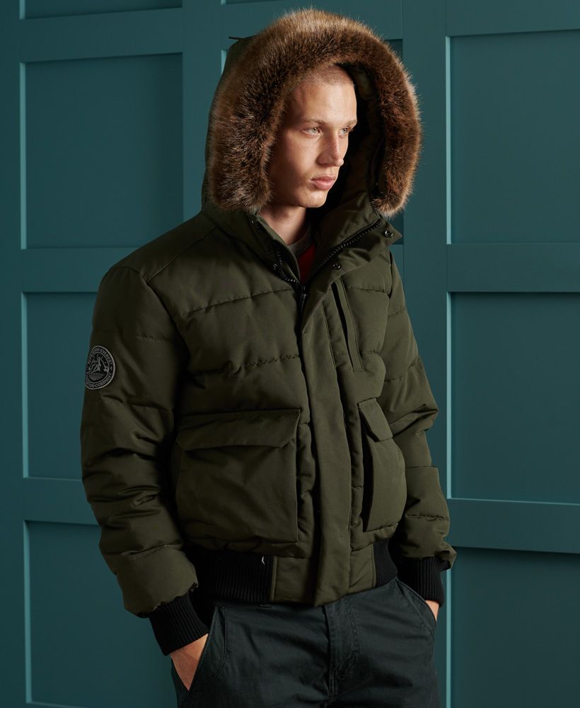 Iconic in style and inspired by the classic bomber jacket, the Everest Quilted Bomber Jacket, featuring a quilted recycled polyester padding designed to keep you warm and cosy on those chilly nights this season. Also featured are four external pockets and one internal breast pocket, ideal for storing your belongings when on your travels. Layer this bomber jacket over any outfit to complete the look.Bungee cord adjuster hoodDetachable faux fur trimMain zip and popper fasteningFive pocket designRibbed cuffs and hemPaddingSignature logo badgeThe padding in this jacket is 100% Recycled Polyester – each jacket contains up to 10 recycled bottles, this avoids these bottles being sent to landfill or polluting our oceans.