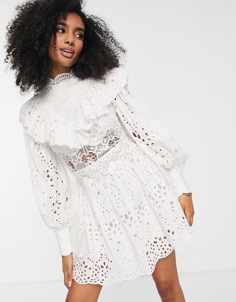 Mini dress by ASOS EDITION Love at first scroll High neck Puff sleeves Button cuffs Ruffle trims Zip-back fastening Regular fit Sold by Asos
