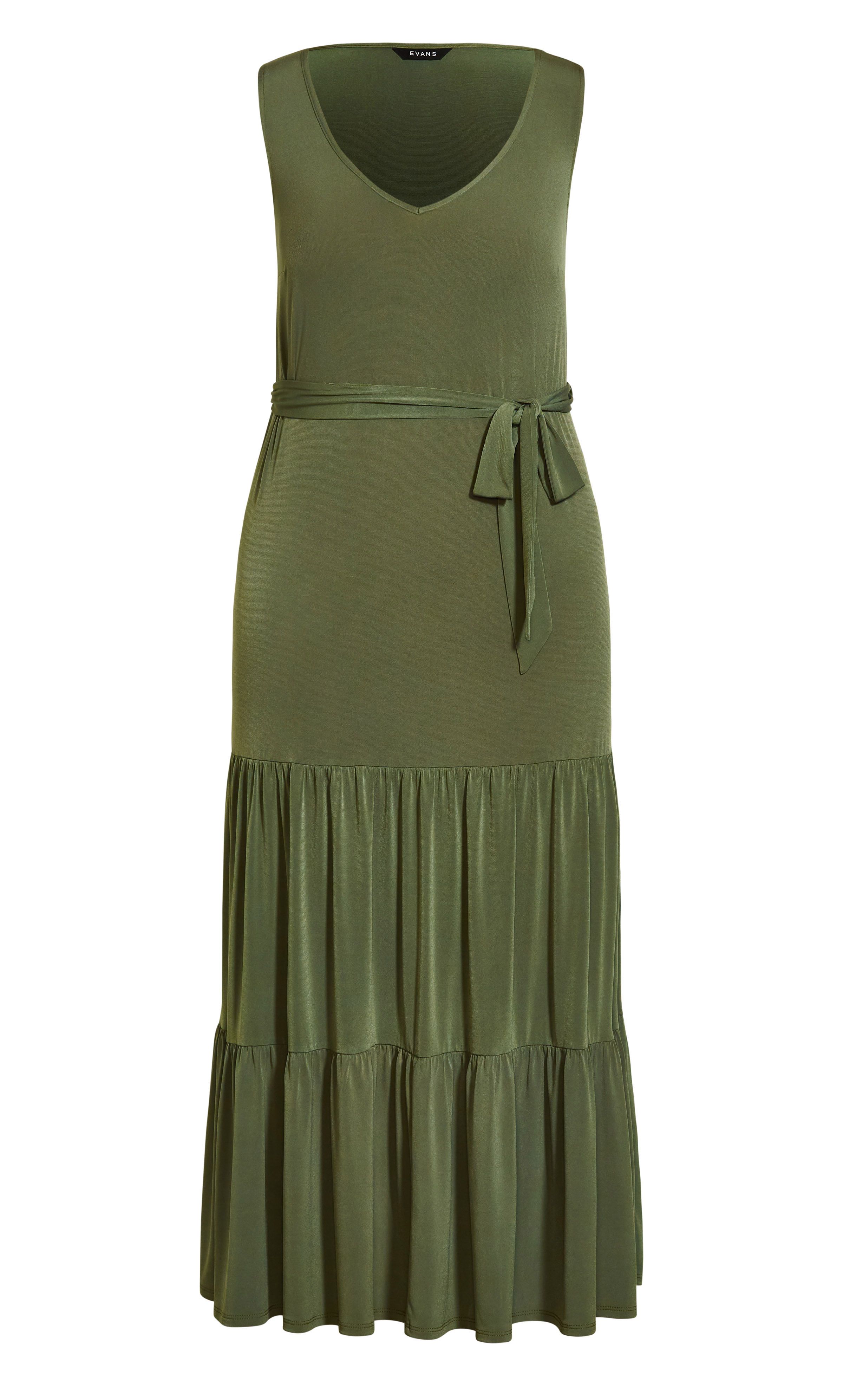 Boasting a trending khaki hue, the Tiered Sleeveless Maxi Dress is bound to become your summer go-to. It features a classic V-neckline and sleeveless cut, with a draping tiered hemline that floats ever so elegantly in motion. Key Features Include: - V-neckline - Sleeveless - Self-tie fabric waist belt - Pull over style - Relaxed fit - Unlined - Maxi length - Ruffle tiered hemline Tie up your look with tan-hued sandals, a pair of cat-eye sunglasses and a chic rattan bag. Summery perfection!