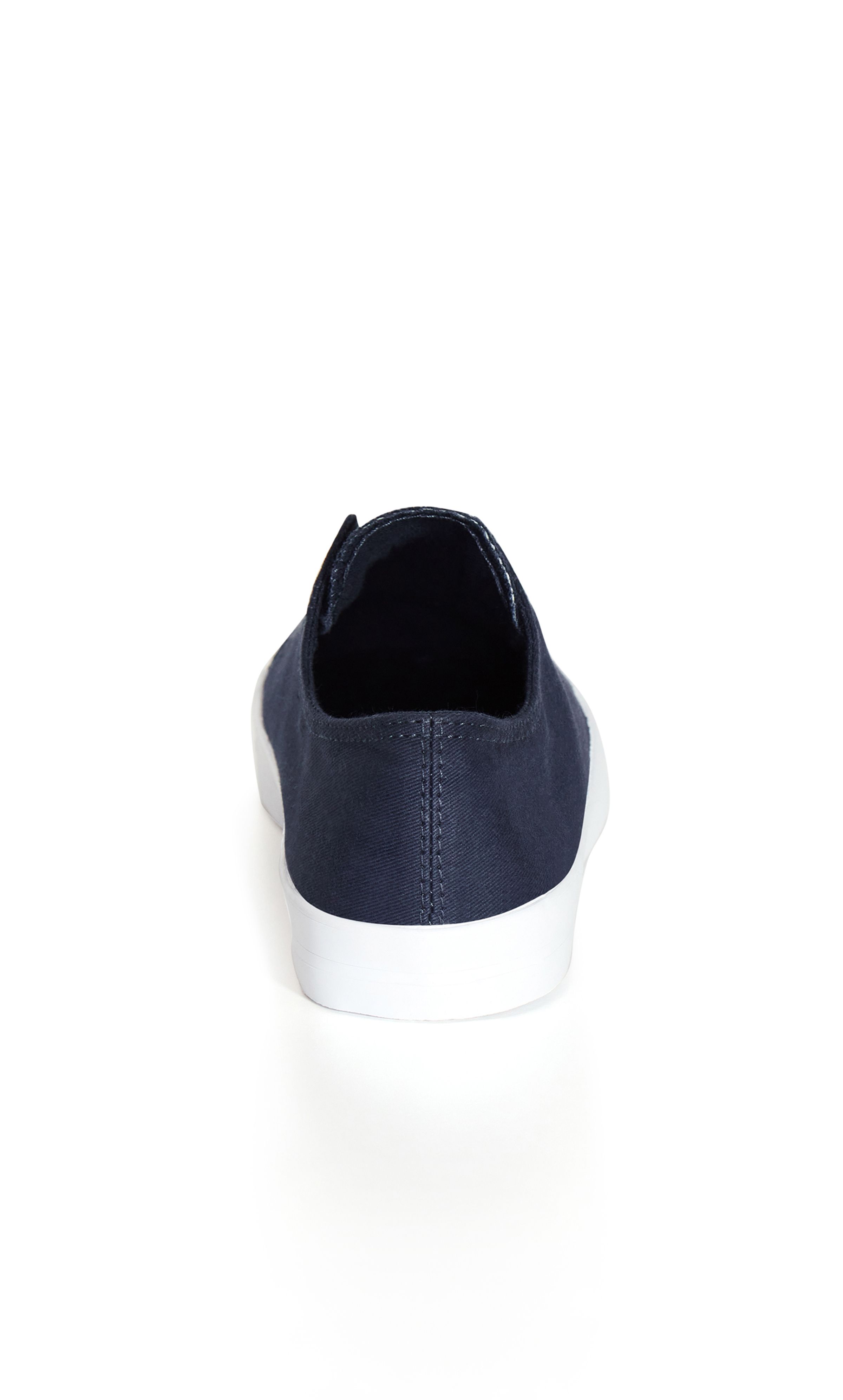 Your classic canvas trainer with a twist — it's laceless! The Laceless Trainer is bound to be on high rotation in your wardrobe this season thanks to a practical slip on style and comfortable rubber sole. Whether you're headed to the shops or a quick coffee catch up, this pair has you covered. Key Features Include: - Round toe - Laceless front - Canvas fabric upper - Slip on style - Thick sole Keep it casual in a slogan tee and long shorts, finishing with your favourite tote.