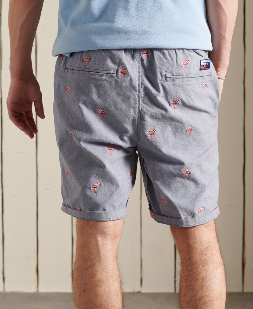 A classic short with a twist. These shorts feature a classic five pocket design and an all over embroidered pattern. Pair with a vest top and sliders for a beach ready look.Button and zip fly fasteningDrawstring elasticated waistFive pocket designSignature logo patchAll over flamingo embroidered design