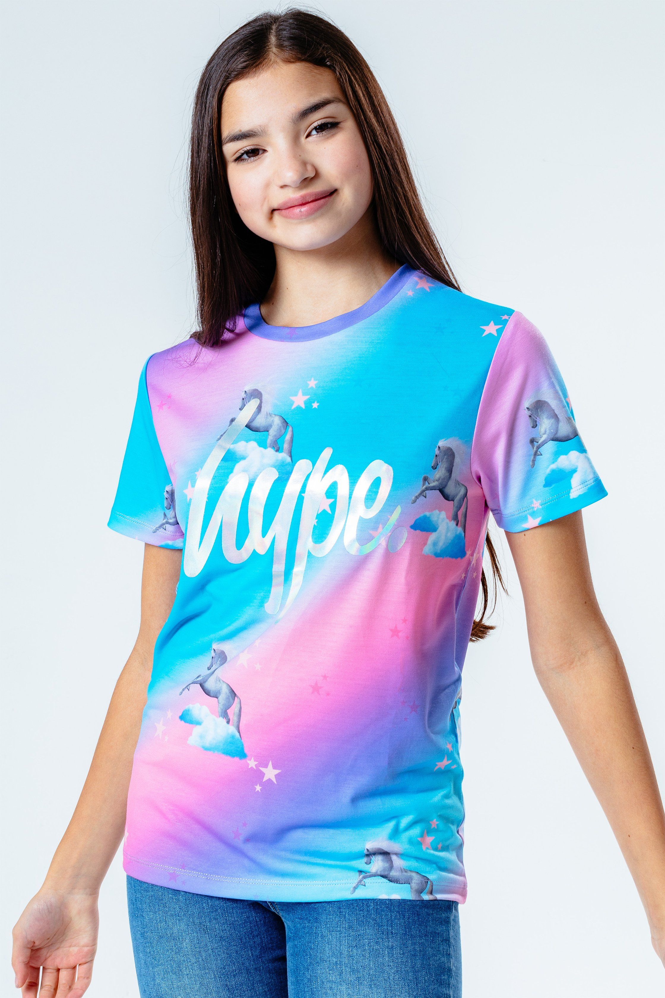 The HYPE. Unicorn Fade Kids T-Shirt is your new go-to tee. Designed in a 95% poly and 5% elastane fabric base for supreme comfort in our standard kids t-shirt shape, highlighting a crew neck line and short sleeves. With the iconic HYPE. lilac script logo in a holographic transfer foil in an all-over pink, purple and blue colour palette with an all over stars and unicorn print. Wear with cycle shorts for an on-trend look. Machine wash at 30 degrees.