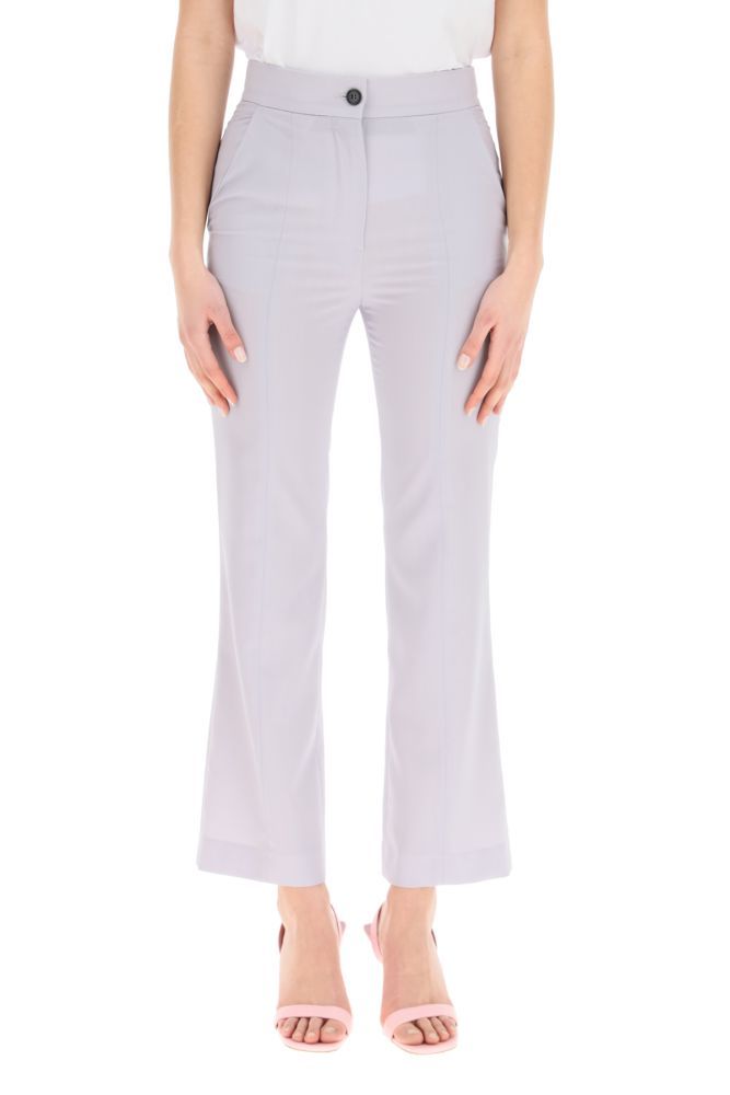 MSGM cool wool trousers with a high-waist ankle-length design, featuring front closure with button and zip fly, French side pockets, welt rear pocket. Regular fit. The model is 177 cm tall and wears a size IT 38.