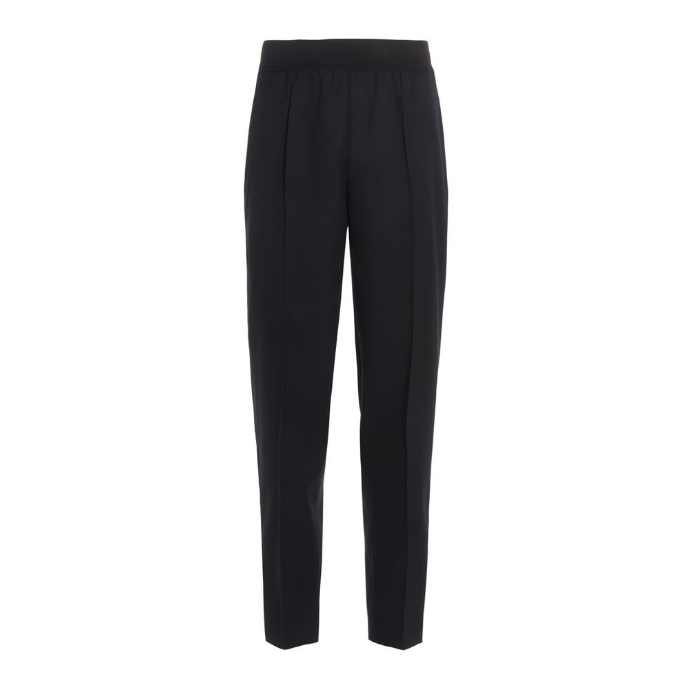 Gabardine virgin wool trousers with an elastic waistband, pockets and front pleats. Featuring a concealed zipped leg bottom closure.