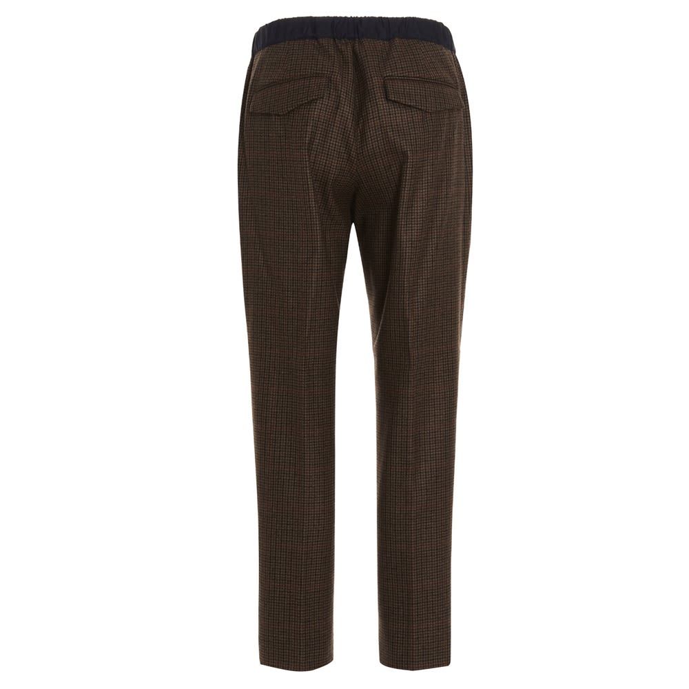 'Rebel' virgin wool trousers (super 100s fancy) with an elastic waistband, a tuck strap, a zip closure and a snap button.