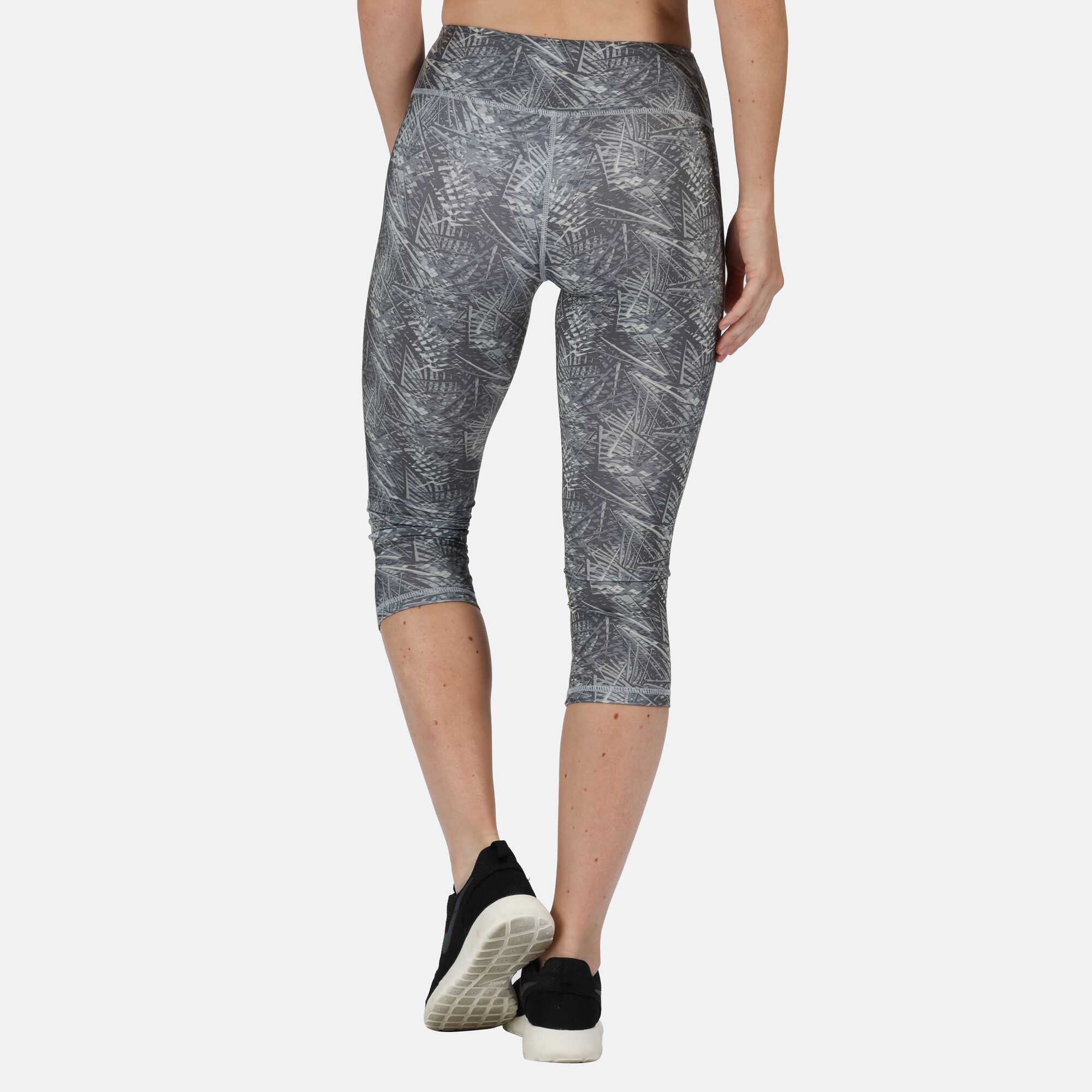 85% polyester, 15% elastane. Good wicking performance. Quick drying. Mesh key/coin pocket at inner waist. No external logo branding.