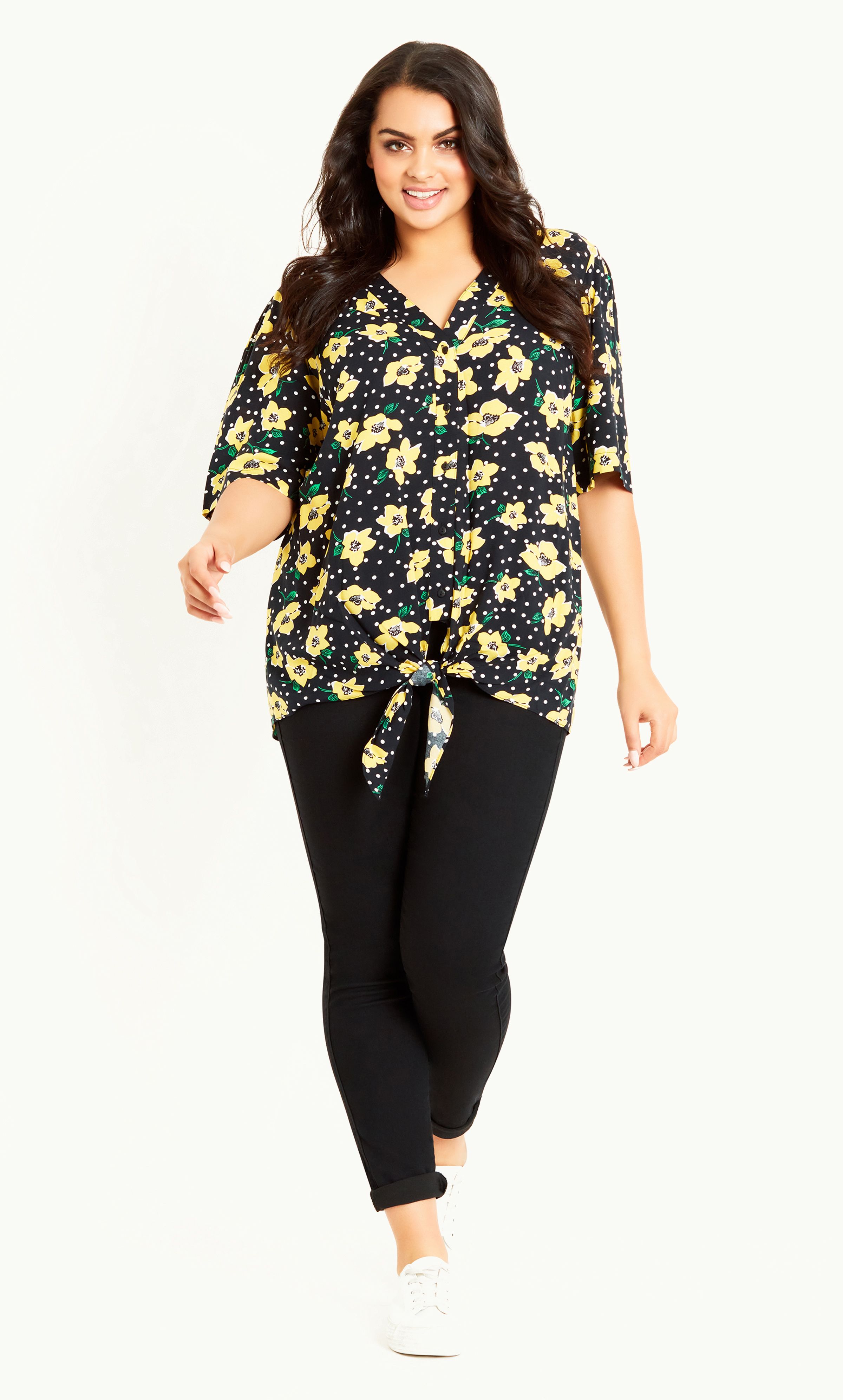 Opt for a totally gorgeous floral print this summer in our Tie Front Print Top! Featuring a V-neckline, short sleeves and buttoned front, this top sure knows how to make a style statement. Key Features Include: - V-neckline - Short sleeves - Textured fabrication with slight stretch - Relaxed fit - Buttoned front - Tie feature - Unlined - Hip length Style with straight jeans, canvas trainers and a cross body bag for the weekend.