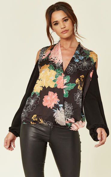 Florals are in this summer season and they are here to stay. This off the shoulder printed floral top is fun and flirty, can be worn by itself or pop the popper and team it with a cute croped tee or vest. It won't disappoint!