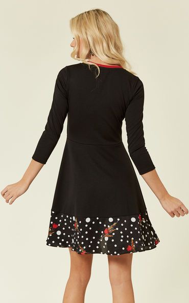 The Pearls Dream mini long-sleeved dress in black is perfect for work or casual drinks. Easy to dress up or down, this playful skater dress is the perfect choice for those throw-down days when you just want throw something on and still look amazing. Featuring three quarter length sleeves, a red collar stripe and polka dot hem details, this little black dress is sure to impress.