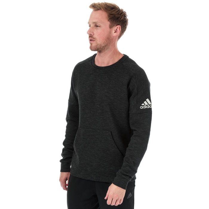 Mens adidas ID Stadium Crew Sweatshirt in black - grey six.<BR><BR>- Crew neck.<BR>- Drop shoulder.<BR>- Long sleeves.<BR>- Kangaroo style pocket to front with internal hidden zip pocket.<BR>- adidas Badge of Sport logo printed at left sleeve.<BR>- Contrast back neck tape.<BR>- Regular fit.<BR>- Measurement from shoulder to hem: 28“ approximately.  <BR>- Shell: 67% Cotton  33% Recycled polyester. Machine washable.<BR>- Ref: DU1145<BR><BR>Measurements are intended for guidance only.