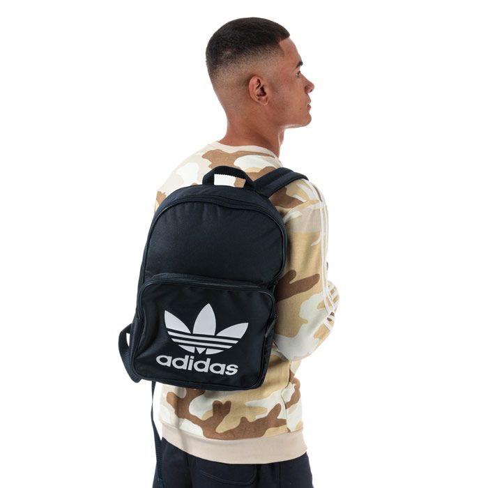 adidas Originals Classic Trefoil Backpack in collegiate navy.<BR><BR>- One main zip compartment.<BR>- Front zip pocket.<BR>- Inner laptop compartment.<BR>- Padded shoulder straps with zigzag stitching.<BR>- Webbing carry handle to top.<BR>- Trefoil branding to front.<BR>- Dimensions: 42cm (H) x 28.5cm (W) x 15cm (D) approximately.<BR>- Main material: 100% Polyester.  Lining: 100% Polyester.  Padding: 100% Polyethylene.<BR>- Ref: DW5189<BR><BR>Measurements are intended for guidance only
