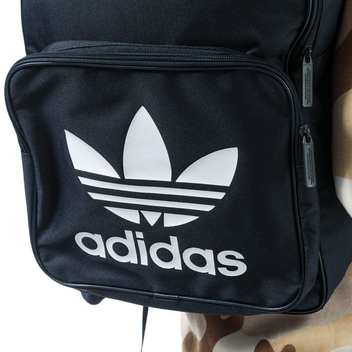 adidas Originals Classic Trefoil Backpack in collegiate navy.<BR><BR>- One main zip compartment.<BR>- Front zip pocket.<BR>- Inner laptop compartment.<BR>- Padded shoulder straps with zigzag stitching.<BR>- Webbing carry handle to top.<BR>- Trefoil branding to front.<BR>- Dimensions: 42cm (H) x 28.5cm (W) x 15cm (D) approximately.<BR>- Main material: 100% Polyester.  Lining: 100% Polyester.  Padding: 100% Polyethylene.<BR>- Ref: DW5189<BR><BR>Measurements are intended for guidance only