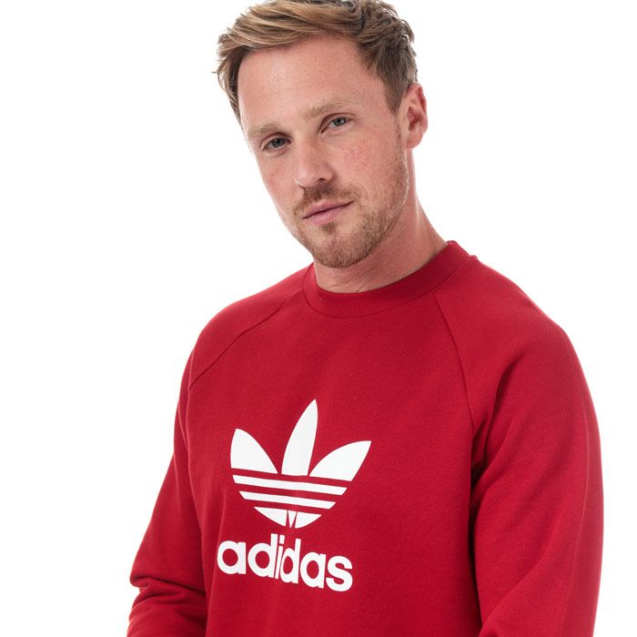 Mens adidas Originals Trefoil Warm-Up Crew Sweatshirt in power red.<BR><BR>Classic crew sweat  crafted from soft French terry.<BR>- Ribbed crew neck.<BR>- Long raglan sleeves.<BR>- Ribbed cuffs and hem.<BR>- Large rubber print Trefoil logo at centre chest.<BR>- Regular fit.<BR>- Measurement from shoulder to hem: 28in approximately.<BR>- Main material: 100% Cotton.  Rib: 95% Cotton  5% Elastane.  Machine washable.<BR>- Ref: DX3615<BR><BR>Measurements are intended for guidance only.
