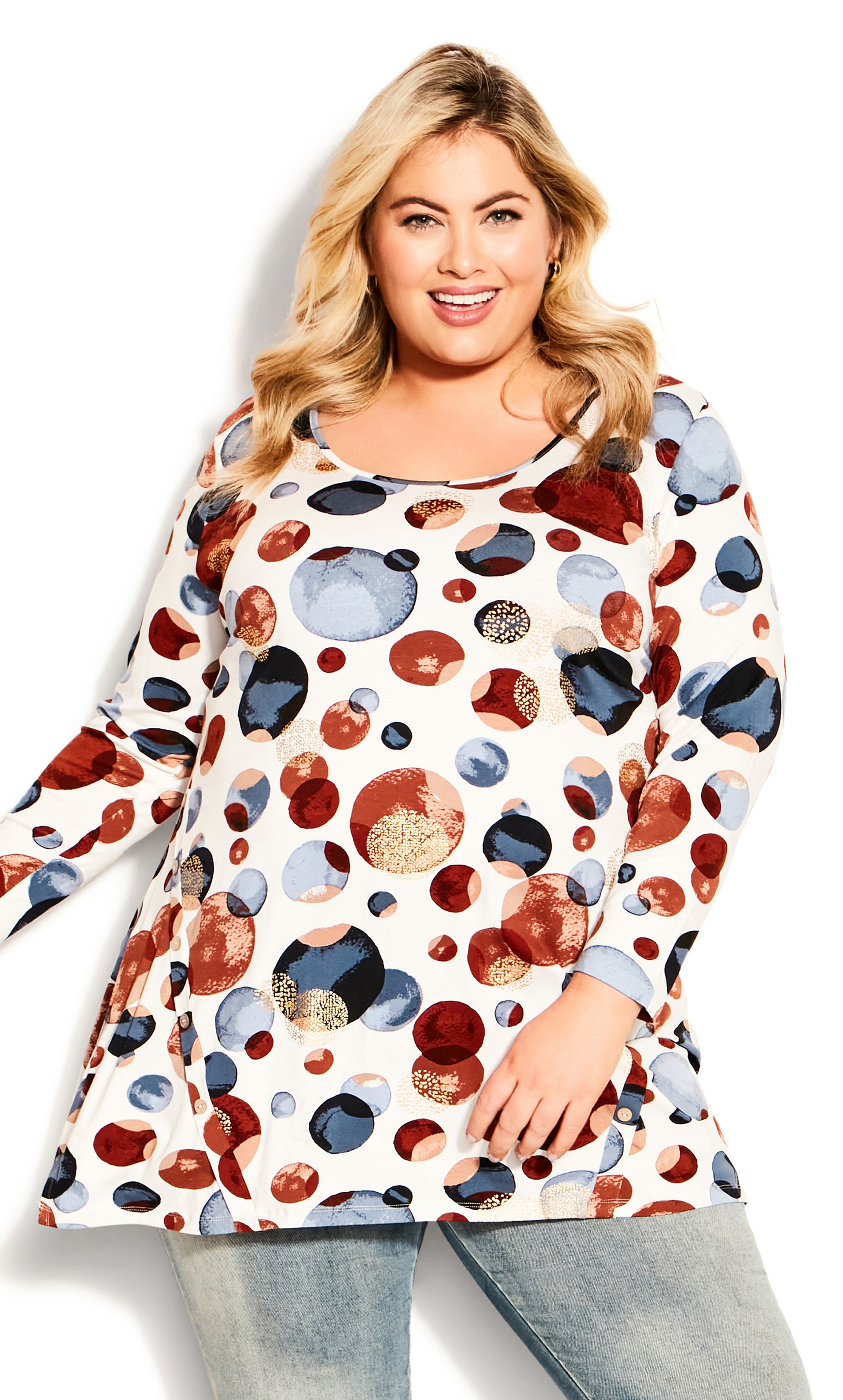 Make styling easy with our Leisure Button Tunic. Crafted in a soft stretch fabrication that complements your curves, the ivory hue can be paired with everything in your wardrobe! Key Features Include: - Scoop neckline - 3/4 length sleeves - Relaxed fit - All-over print - Asymmetrical button detailing - Stretch fabrication Keep it simple with black leggings and sandals.