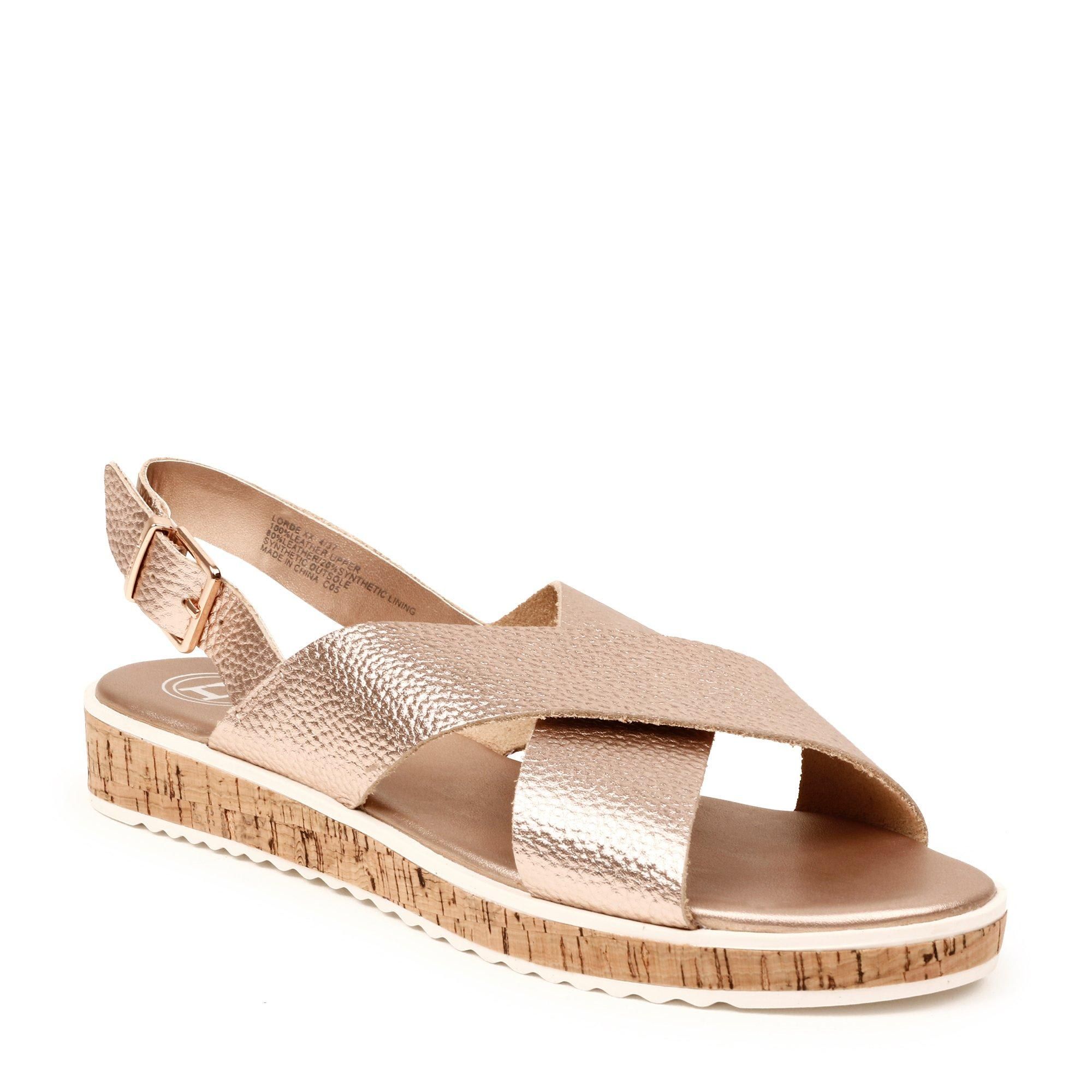 Channel casual elegance with this fetching Dune London sandal. Designed with stylish cross straps and a buckle fastening at the ankle. A flat cork heel and shark sole complete this summer style.