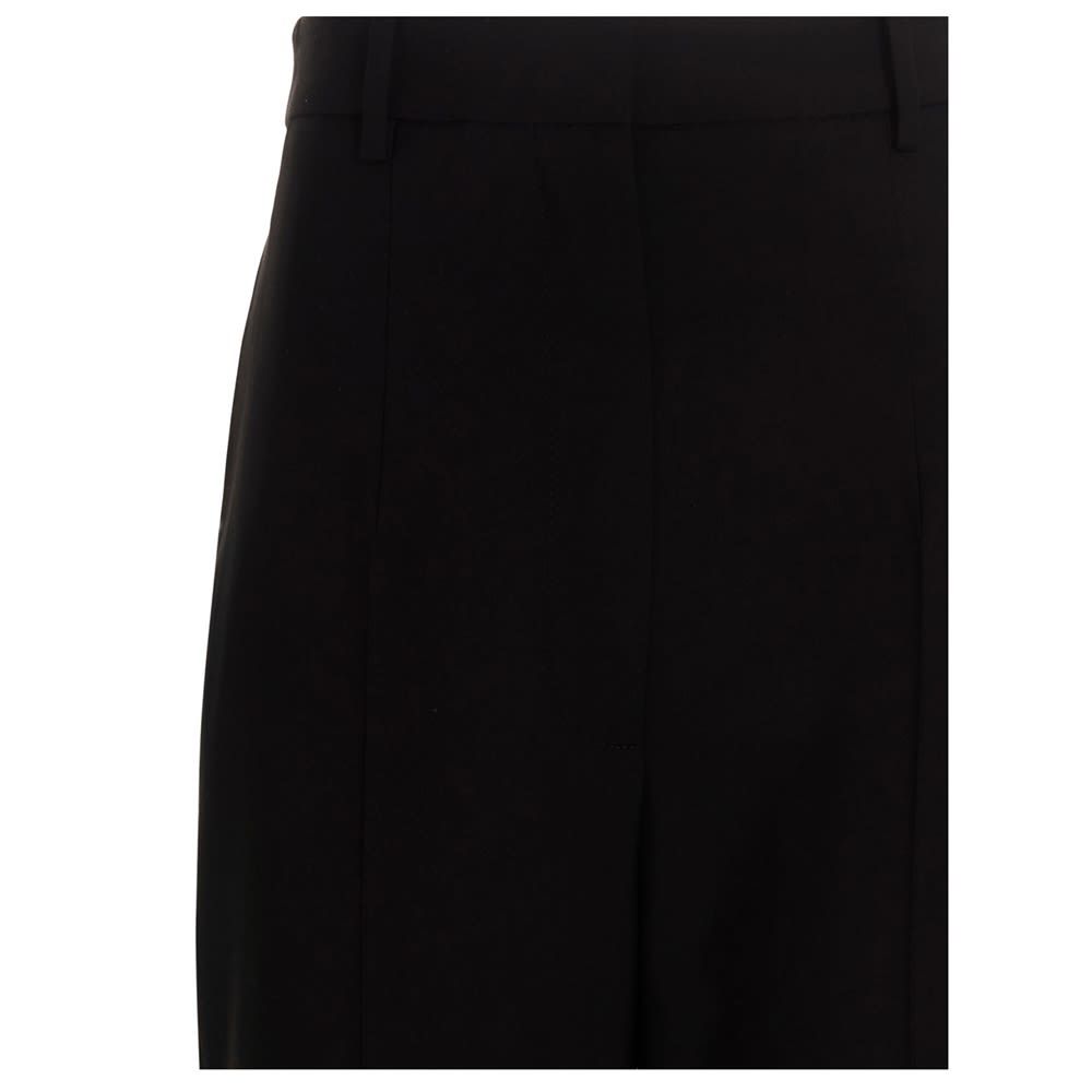 Virgin wool trousers with a zip closure, hook and button.