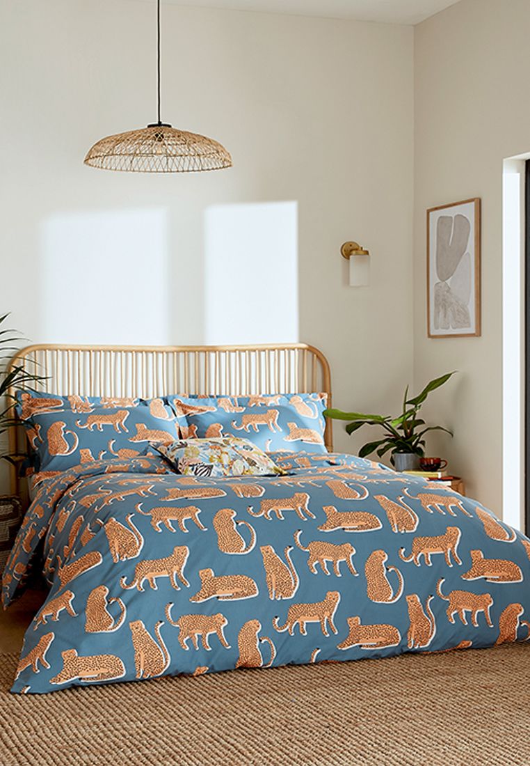 Embrace your wild side with this quirky design from the Scion design studio. Lionel the leopard is seen lounging, sitting and strolling across this striking duvet cover set. Printed on 100% cotton and available in four sizes, the duvet cover and Oxford pillowcase flip over to reveal a small-scale leopard print on the reverse. Keep an eye out for Lionel on the cotton accessory cushion, where he can be seen deep in the tropical foliage. Made in Pakistan.