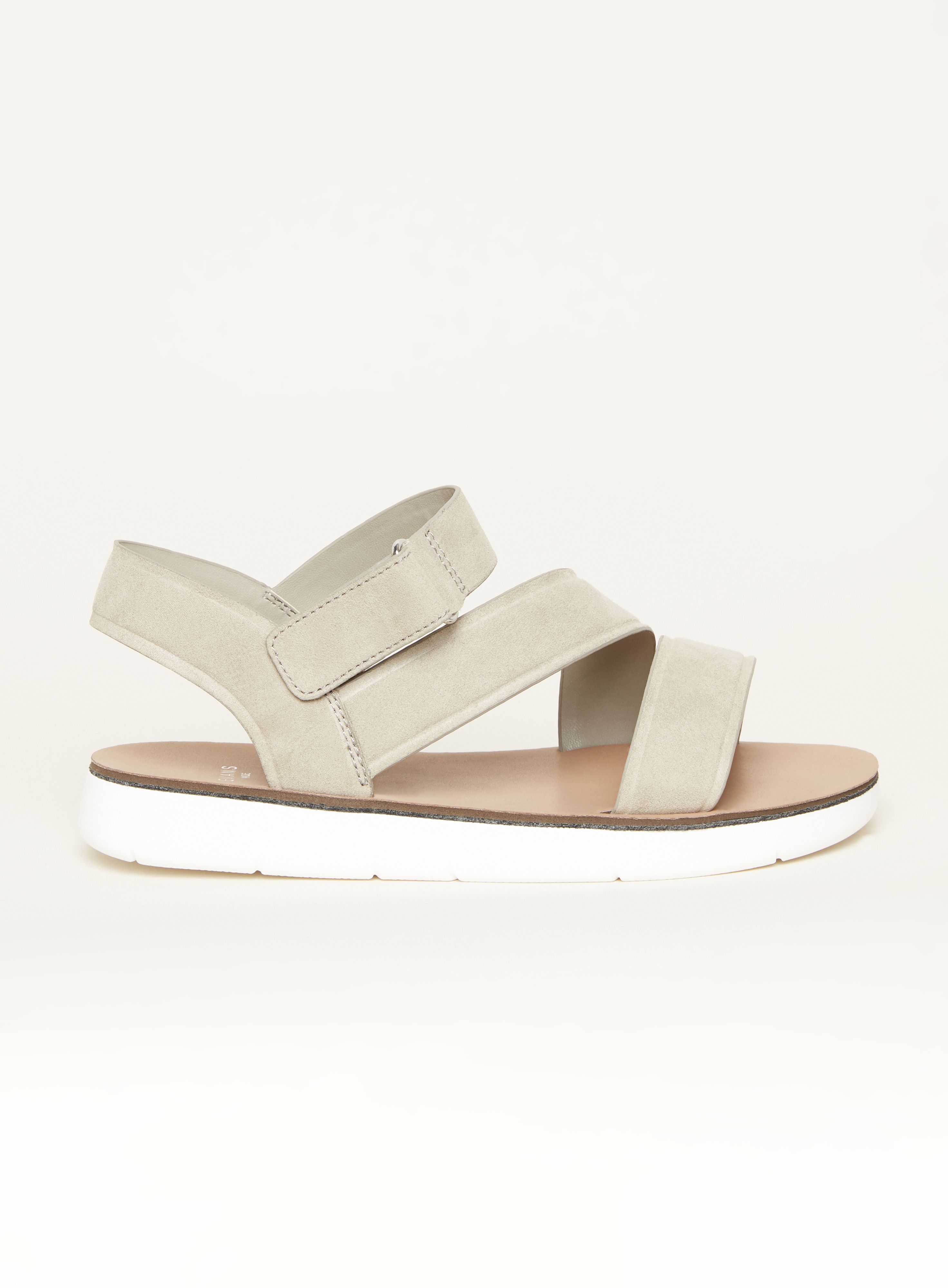 Combining practical comfort with trending style, the Cross Strap Sporty Sandal is bound to become your summer go-to. Finished with thick strapping and a chunky sole, you'll be reaching for these sandals every weekend! Key Features Include: - Wide fit - Side velcro closure - Flat sole - Faux-suede fabrication Team with frayed shorts and a slogan tee for pared back summer style.