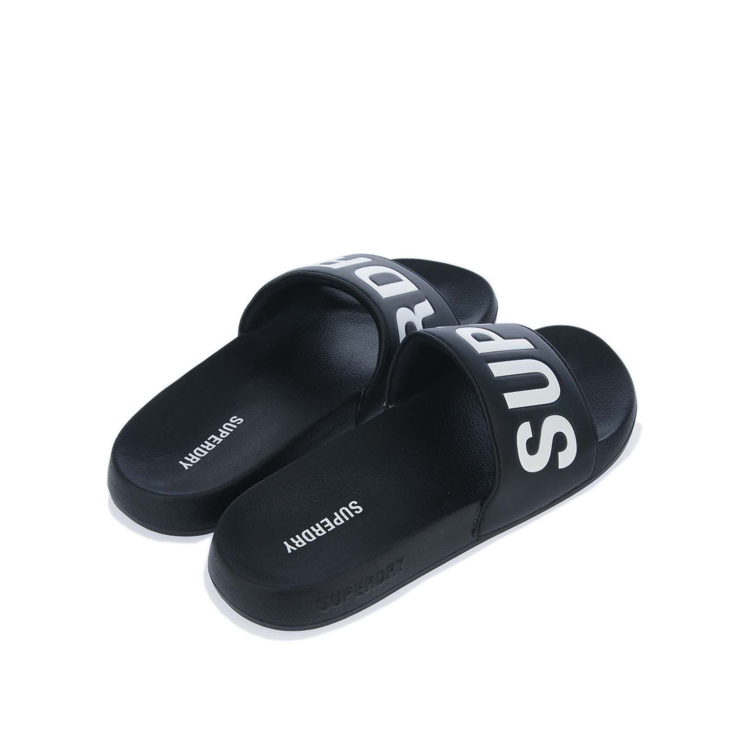 Mens Superdry Code Core Pool Slides in black.- Synthetic upper.- Slip on fastening.- Embossed Superdry logo on side.- Branded footbed.- Moulded sole with a Superdry logo.- Synthetic upper  Textile and synthetic lining.- Ref: MF310199A33B