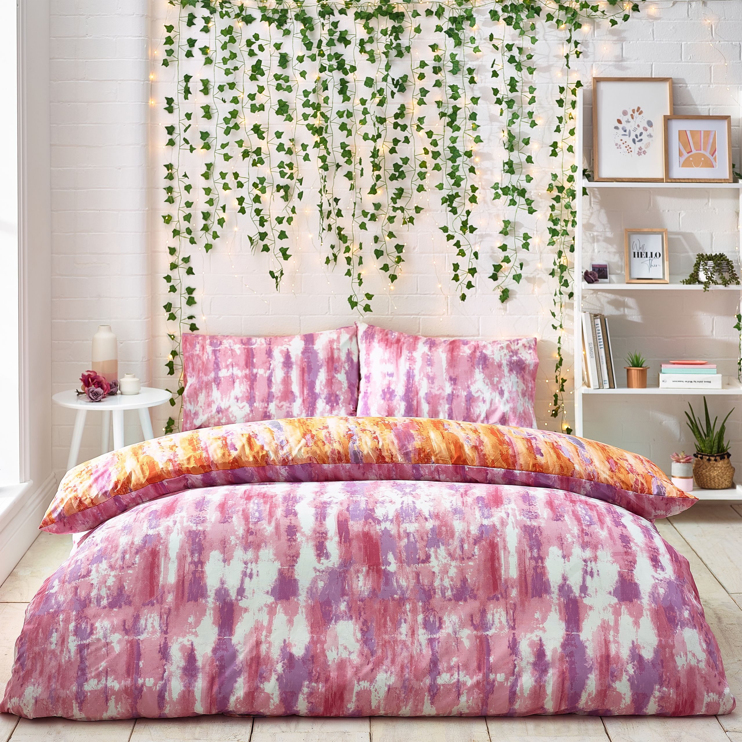 Add instant personality to your bedroom with this Tie Dye duvet set. Featuring a vibrant tie dye design. The colour continues to the reverse with a purple and pink tie dye design so you can switch the look when you need to.