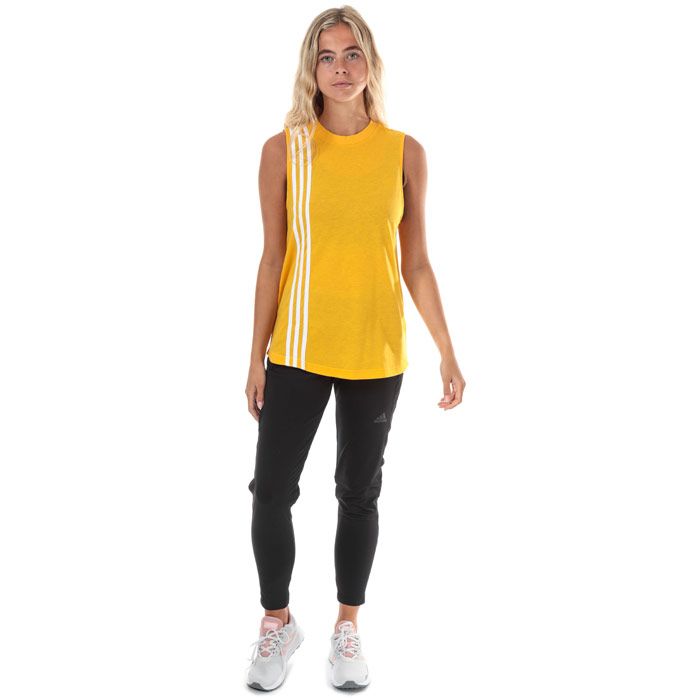 Womens adidas Must Haves 3-Stripes Tank Top in active gold - white.<BR><BR>- Ribbed crew neck. <BR>- Sleeveless.<BR>- Curved hem.<BR>- Applied 3-Stripes over right shoulder from front to back.<BR>- adidas Badge of Sport logo printed at back neck.<BR>- Branded back neck tape.<BR>- Loose fit.<BR>- Measurement from shoulder to hem: 25“ approximately.  <BR>- Main material: 50% Recycled polyester  25% Cotton  25% Viscose.  Machine washable.<BR>- Ref: EB3817<BR><BR>Measurements are intended for guidance only.