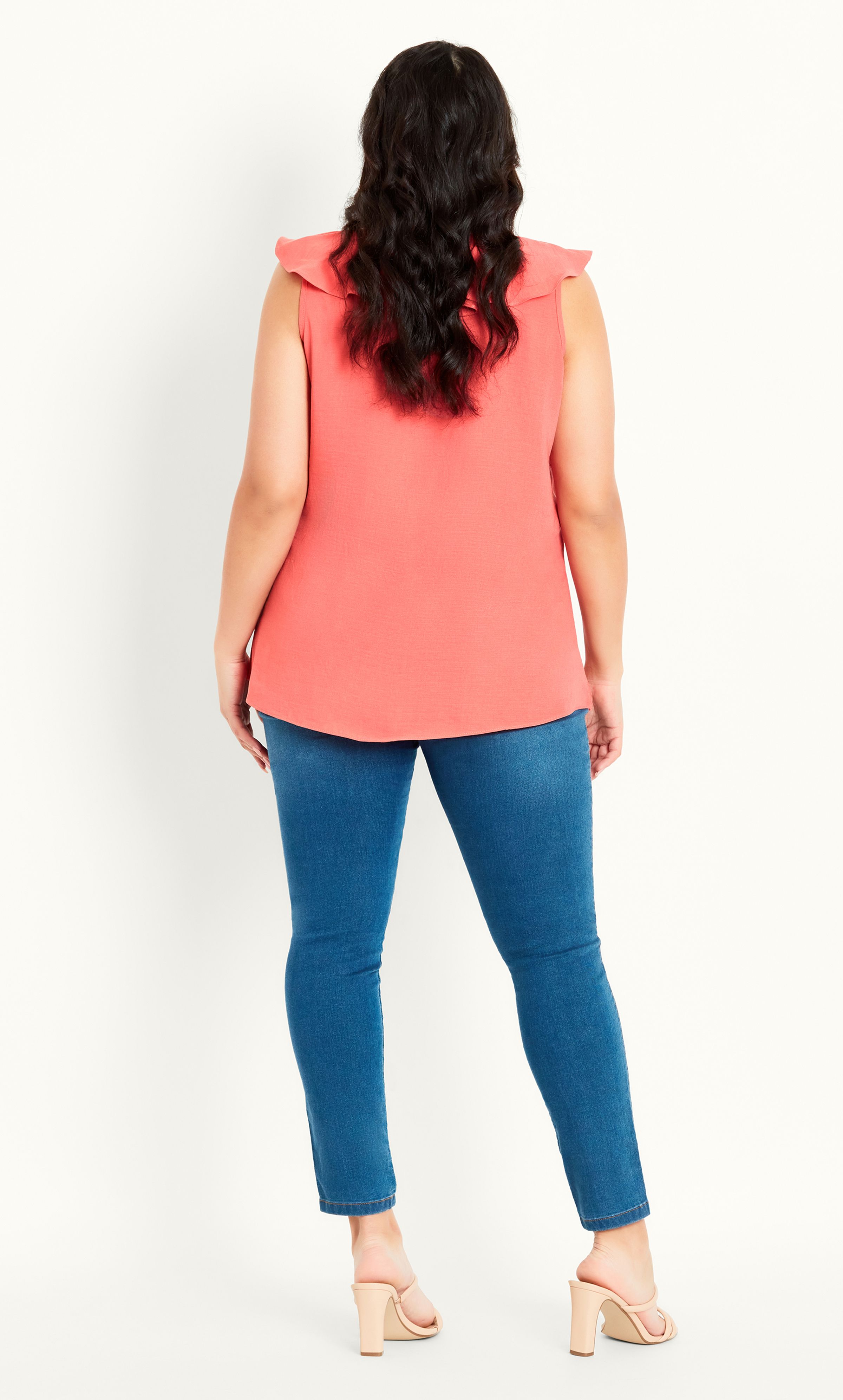 Looking to inject some colour to your wardrobe? Our Frill Vest is a timeless and versatile choice, offering a chic coral hue that'll breathe life into your casual outfit. Complete with a feminine frilled neckline, you'll be reaching for this sleeveless top on repeat! Key Features Include: - V-neckline with frill trim - Darted bust for shape - Relaxed fit - Pull over design - Woven non-stretch fabrication Tuck this top into a denim mini skirt, finishing with espadrille sandals and tortoise shell sunglasses for a cute summer outfit.