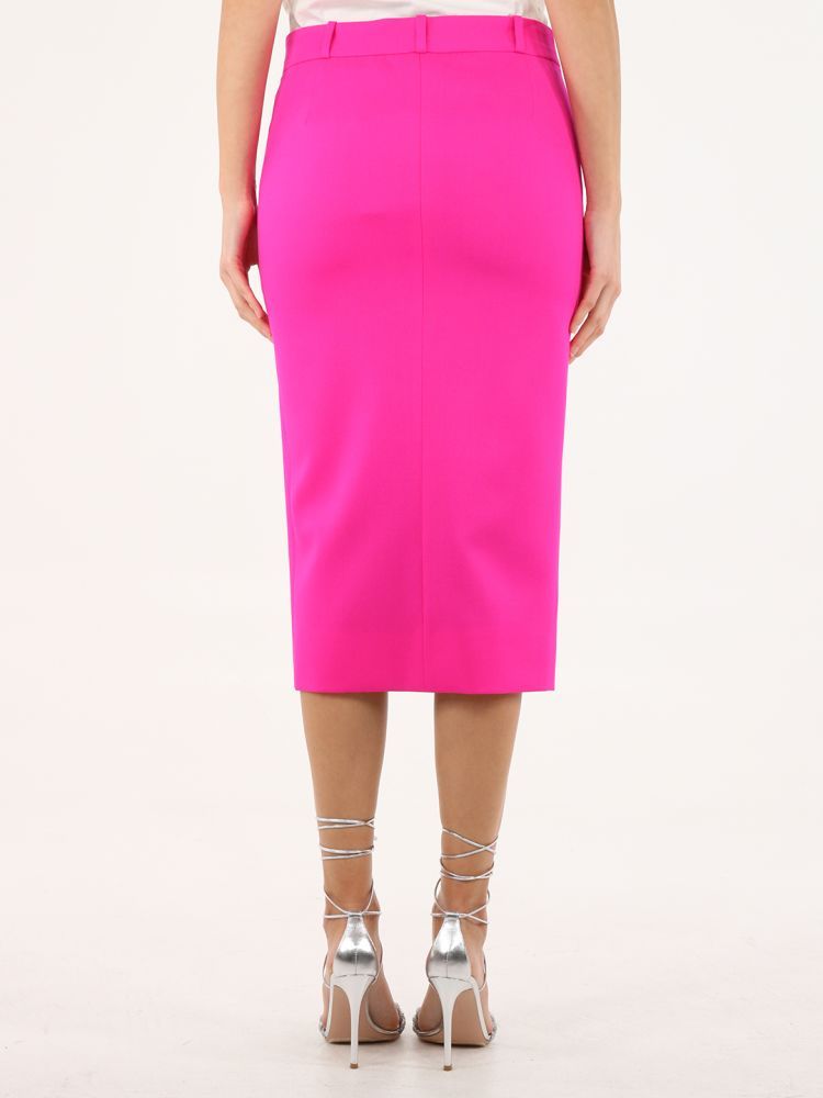 Cat fuchsia pencil skirt in crêpe with single vent, hook closure and concealed zipper.The model is 178cm tall and wears size 40. 