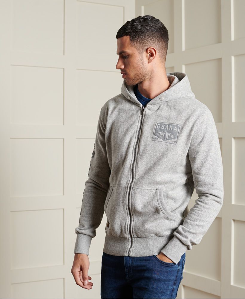 Add another essential to your wardrobe with the Modern Workwear zip hoodie. A classic style zip hoodie featuring two pouch pockets, a soft brushed lining and embroidered designs.Slim fit – designed to fit closer to the body for a more tailored lookMain zip fasteningAttached hoodBrushed liningRibbed cuffs and hemTwo pouch pocketsEmbroidered designsSignature logo patch