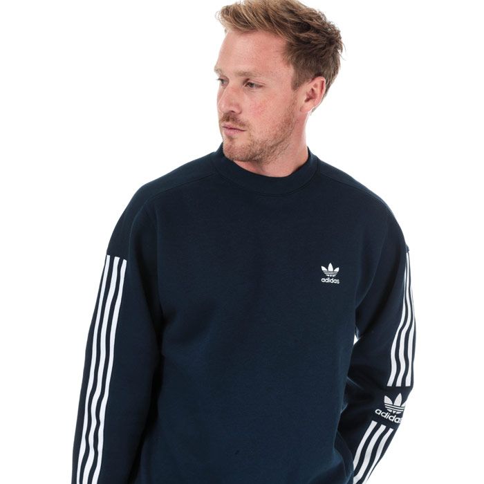 Mens adidas Originals Tech Crew Neck Sweatshirt in collegiate navy.<BR><BR>- Ribbed crew neck.<BR>- Long sleeves with stretch 3-Stripes panel.<BR>- Ribbed cuffs and hem.<BR>- Soft cotton fleece fabric.<BR>- Embroidered Trefoil logo at left chest and left sleeve.<BR>- Tonal back neck tape.<BR>- Regular fit.<BR>- Main material: 77% Cotton  23% Recycled polyester.  Machine washable.<BR>- Ref: ED6122