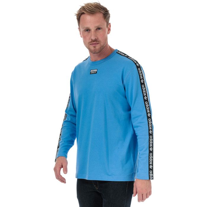 Mens adidas Originals R.Y.V. Long Sleeve T-Shirt in real blue.<BR><BR>- Ribbed crew neck.<BR>- Long sleeves.<BR>- Soft cotton jersey fabric.<BR>- Double linear Trefoil logo tape at shoulders and sleeves.<BR>- Woven double linear Trefoil logo at centre chest.<BR>- Regular fit.<BR>- Main material: 100% Cotton.  Machine washable.<BR>- Ref: ED7199