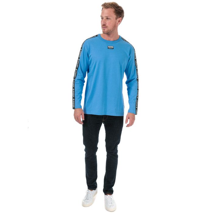 Mens adidas Originals R.Y.V. Long Sleeve T-Shirt in real blue.<BR><BR>- Ribbed crew neck.<BR>- Long sleeves.<BR>- Soft cotton jersey fabric.<BR>- Double linear Trefoil logo tape at shoulders and sleeves.<BR>- Woven double linear Trefoil logo at centre chest.<BR>- Regular fit.<BR>- Main material: 100% Cotton.  Machine washable.<BR>- Ref: ED7199