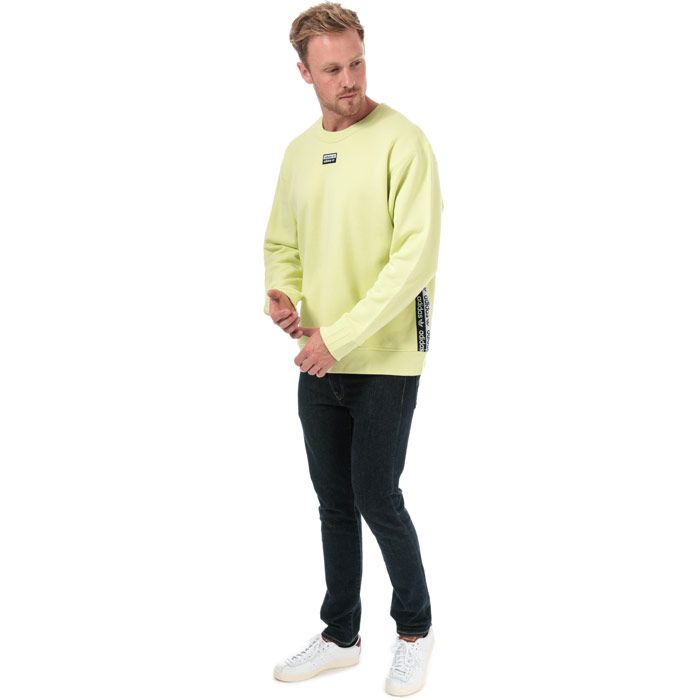 Mens adidas Originals R.Y.V. Crew Sweatshirt in ice yellow.<BR><BR>- Ribbed crew neck.<BR>- Long sleeves with applied 3-Stripes at cuffs.<BR>- Double linear Trefoil logo tape to sides.<BR>- Ribbed cuffs and hem.<BR>- Woven double linear Trefoil logo at centre chest.<BR>- Regular fit.<BR>- Main material: 100% Cotton.  Machine washable.<BR>- Ref: ED7202