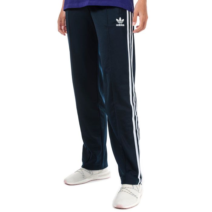 Womens adidas Originals Firebird Track Pants in collegiate navy.<BR><BR>- Iconic track pants crafted in smooth  shiny tricot.<BR>- Elasticated waist with inner drawcord.<BR>- Zipped front pockets.<BR>- Pintuck seams at front legs.<BR>- Ankle zips for easy on - off.<BR>- Applied 3-Stripes to legs.<BR>- Embroidered Trefoil logo at left thigh.<BR>- Regular fit.<BR>- Inside leg measures 32in approximately.  <BR>- Main material: 100% Recycled polyester.  Machine washable.<BR>- Ref: ED7509<BR><BR>Measurements are intended for guidance only.