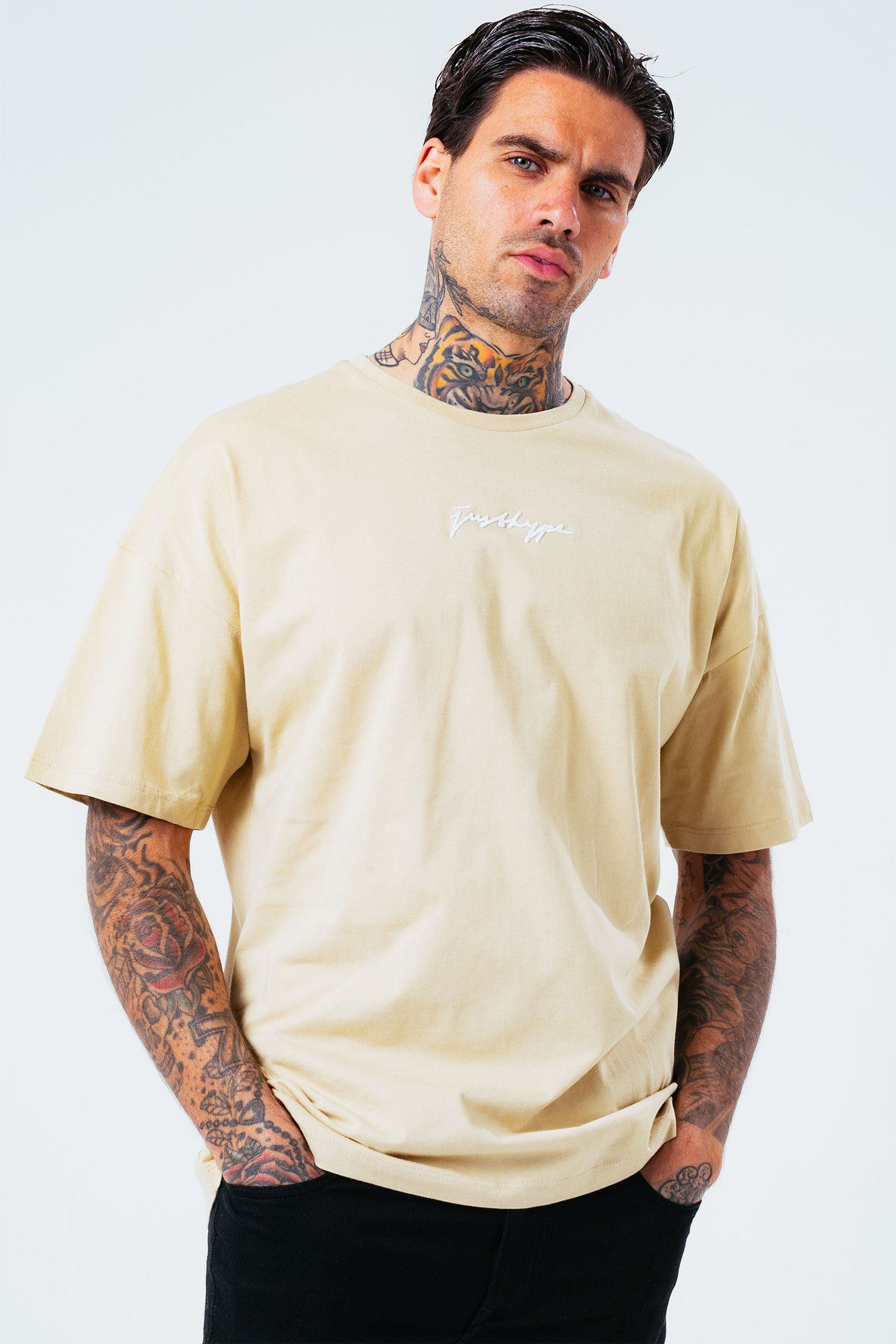 The HYPE. Ecru Oversized Men's T-shirt boasts a neutral-beige colour palette in an 100% cotton fabric base for supreme comfort. Designed in our oversized men's tee shape, with a crew neck line and oversized sleeve drops for a trending oversized fit. Finished with an embroidered mini H on the front. Wear with black skinny fit jeans for a smart-casual vibe. Machine wash at 30 degrees.