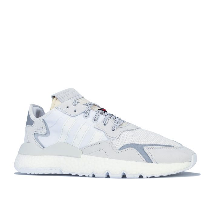 Mens adidas Originals Nite Jogger Trainers in crystal White - cloud White. – Textile and mesh knit upper with premium suede and reflective overlays. – Lace closure. – Comfortable textile lining. – Removable cushioned insole. – boost midsole provides light fast energy with every stride. – Suede tongue patch with debossed adidas Originals branding and 3D Morse code graphic. – Reflective heel patch. – 3-Stripes to sides. – 3M™ Scotchlite™ reflective graphic branding. – Rubber outsole. – Textile leather and synthetic upper – Textile lining – Synthetic sole. – Ref: EE5855