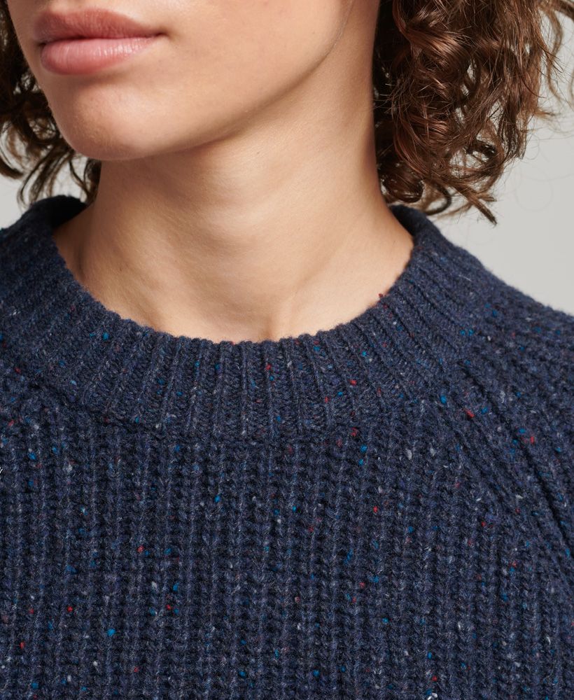 Those colder months are on their way so stock up on your winter cosies while you can. Wool-rich and drawing on the heritage of an outdoors lifestyle, this Tweed Ribbed Crew Neck Jumper will be the one you turn to for your unique and relaxed style when the weather takes a turn.Relaxed fit – the classic Superdry fit. Not too slim, not too loose, just right. Go for your normal sizeRibbed designCrew necklineSignature patch logoLambswool rich fabric