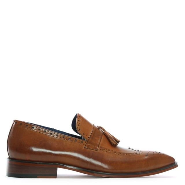 The Daniel Evershot Leather Brogue Loafers are a classic style and a wardrobe staple. This example is crafted from a premium leather upper with luxurious leather lining. An easy to wear slip on style. Heritage brogue embossed detail adds detail to the upper as well as tassel. This signature style will see you through Season after Season.