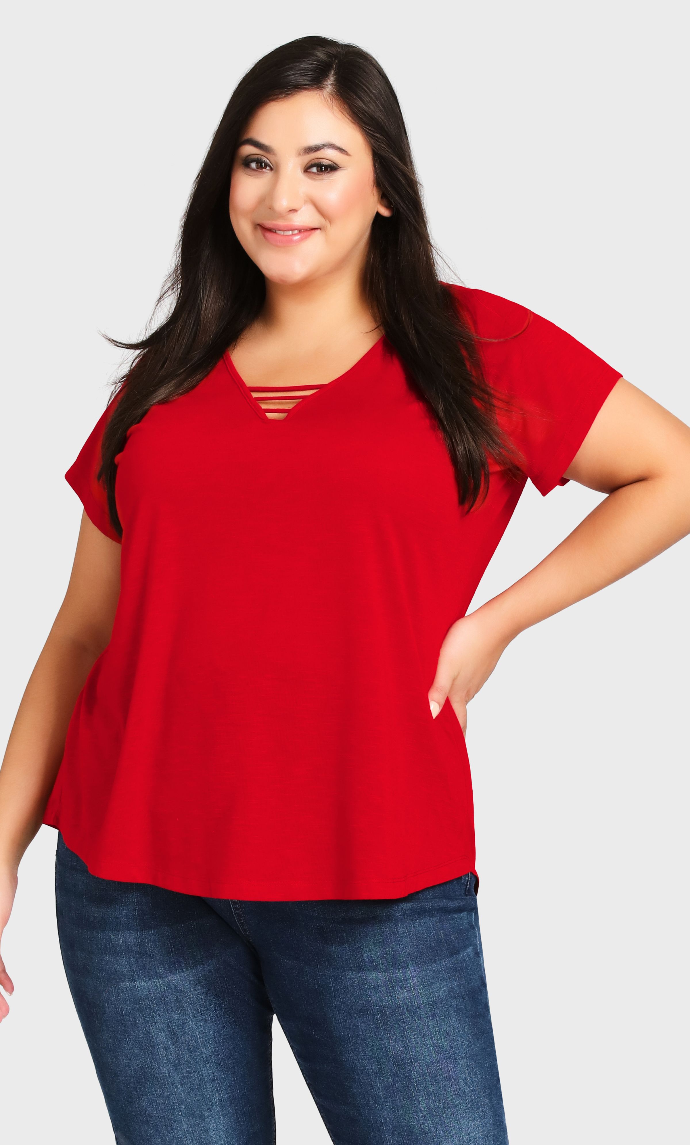 A bold take on a classic shape, the red 3 Bar V Neck Top is sure to make waves. The comfortable fabrication and easy everyday shape have an extra level of glamour from the feature neckline. Bright and exciting, you'll be glowing in this gorgeous top. Key Features Include: - V-neckline with strap detailing - Short sleeves - Pull-over fit - Stretch fabrication - Relaxed silhouette - Straight hemline at hips A pair of cuffed denim shorts are the perfect match for this top.