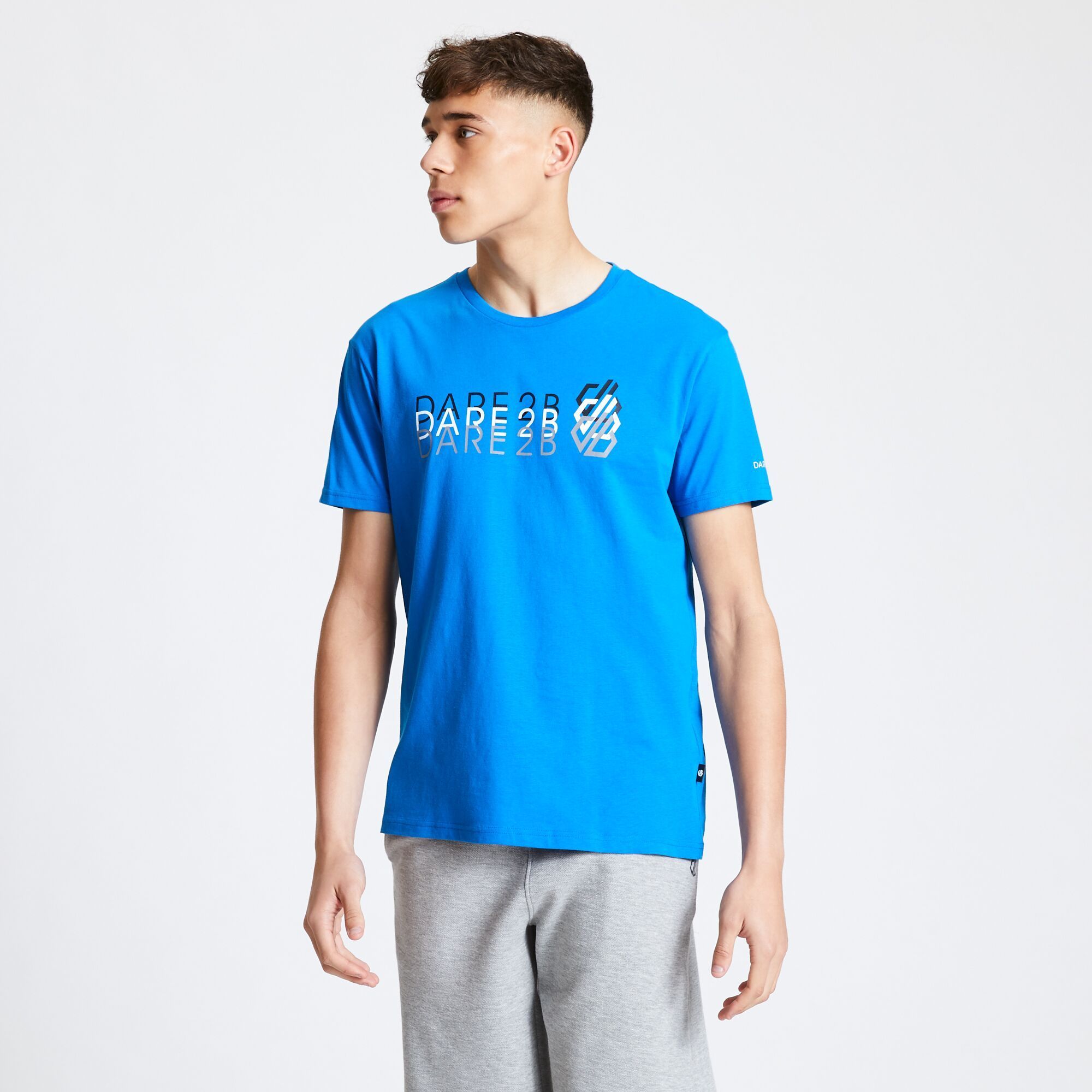 Material: 100% Cotton. Soft jersey fabric. Short sleeved with ribbed collar and round neck. Features 2 colour toned Dare 2B logo graphic print on the front.