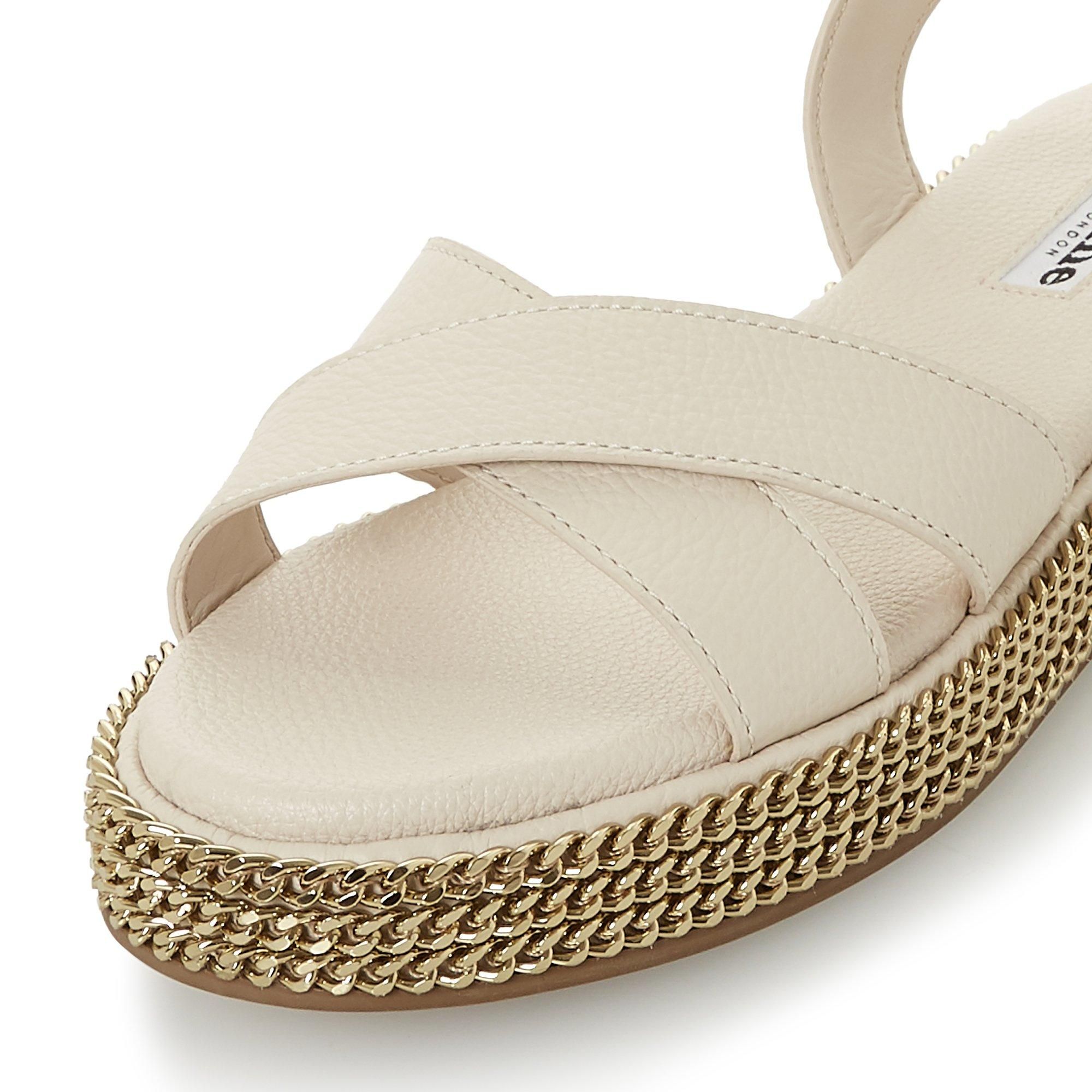 Toughen up summer and holiday edits with this sandal. Fitted with a buckled ankle strap and crossed bands at the upper. Its comfortable chunky sole is embellished with striking chains.