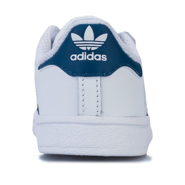Infant Boys adidas Originals Superstar Trainers in footwear White - legend marine. – Smooth coated leather upper. – Elasticated lace closure for easy on-off. – Classic rubber shell toe. – Padded collar and tongue. – -3-Stripes to sides with printed ‘Superstar’ to side. – Printed Trefoil branding to tongue. – Contrast heel patch with printed Trefoil logo. – Comfortable textile lining. – Removable Ortholite sockliner for comfort and odour control. – Herringbone-pattern rubber cupsole. – Includes set of regular laces. – Leather and synthetic upper – Textile and synthetic lining – Synthetic sole. – Ref: F34165