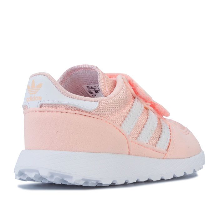 Infant Girls adidas Originals Forest Grove Trainers in clear Orange - footwear White. – Retro running-inspired sneakers. – Synthetic suede and nylon upper. – Double hook and loop closure for easy on-off. – Lightly padded collar and tongue. – Contrast 3-Stripes to sides. – Welded adidas Originals logo to tongue. – Contrast heel tab with printed Trefoil branding. – Removable Ortholite sockliner for comfort and odour control. – Lightweight EVA midsole with diamond foxing. – Rubber outsole. – Textile and synthetic upper – Textile lining – Synthetic sole. – Ref: EE6589
